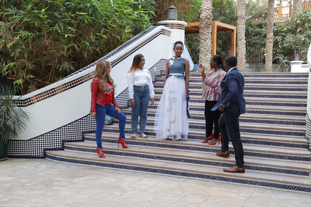 Senator, Dr. Rasha Kelej, CEO of Merck Foundation displaying her designs on Stopping Child Marriage for Our Africa TV Show