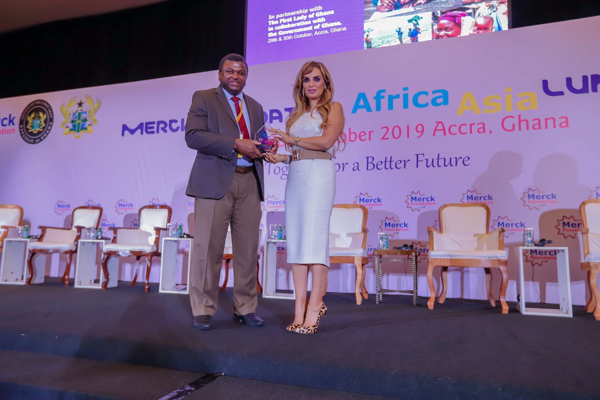 Dr. Rasha Kelej, CEO of Merck Foundation felicitating Hon. Dr. Ahmadou Samateh, Minister of Health, Republic of The Gambia with a Merck Foundation Partnership Award to acknowledge his great support to our programs